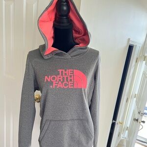 The north face neon bright inner hoodie and like a dark/medium gray main color